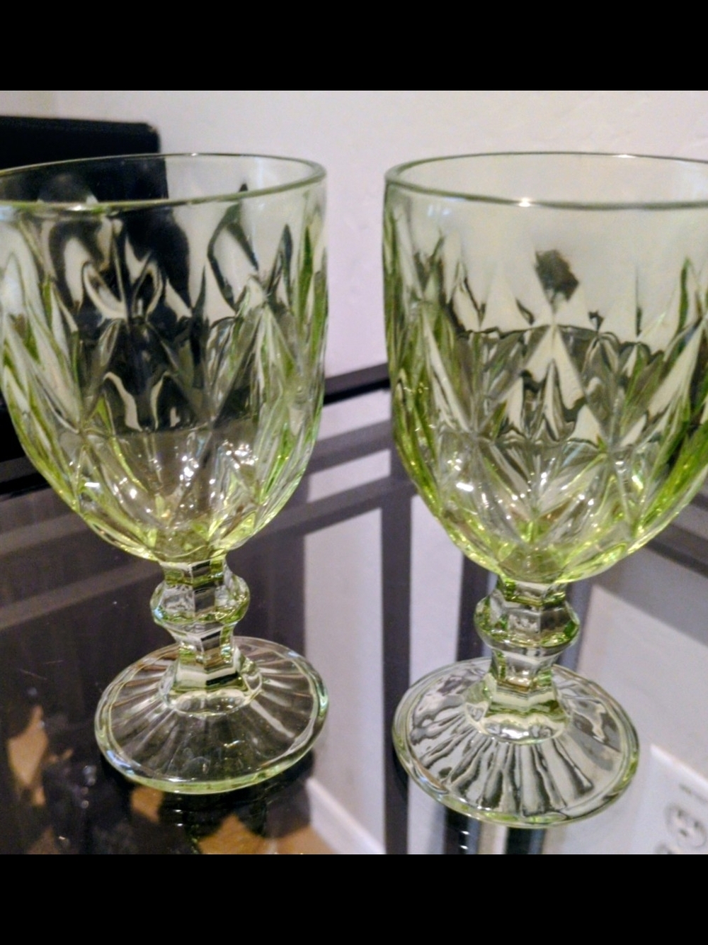 Pair of vintage green embossed glass wine goblet